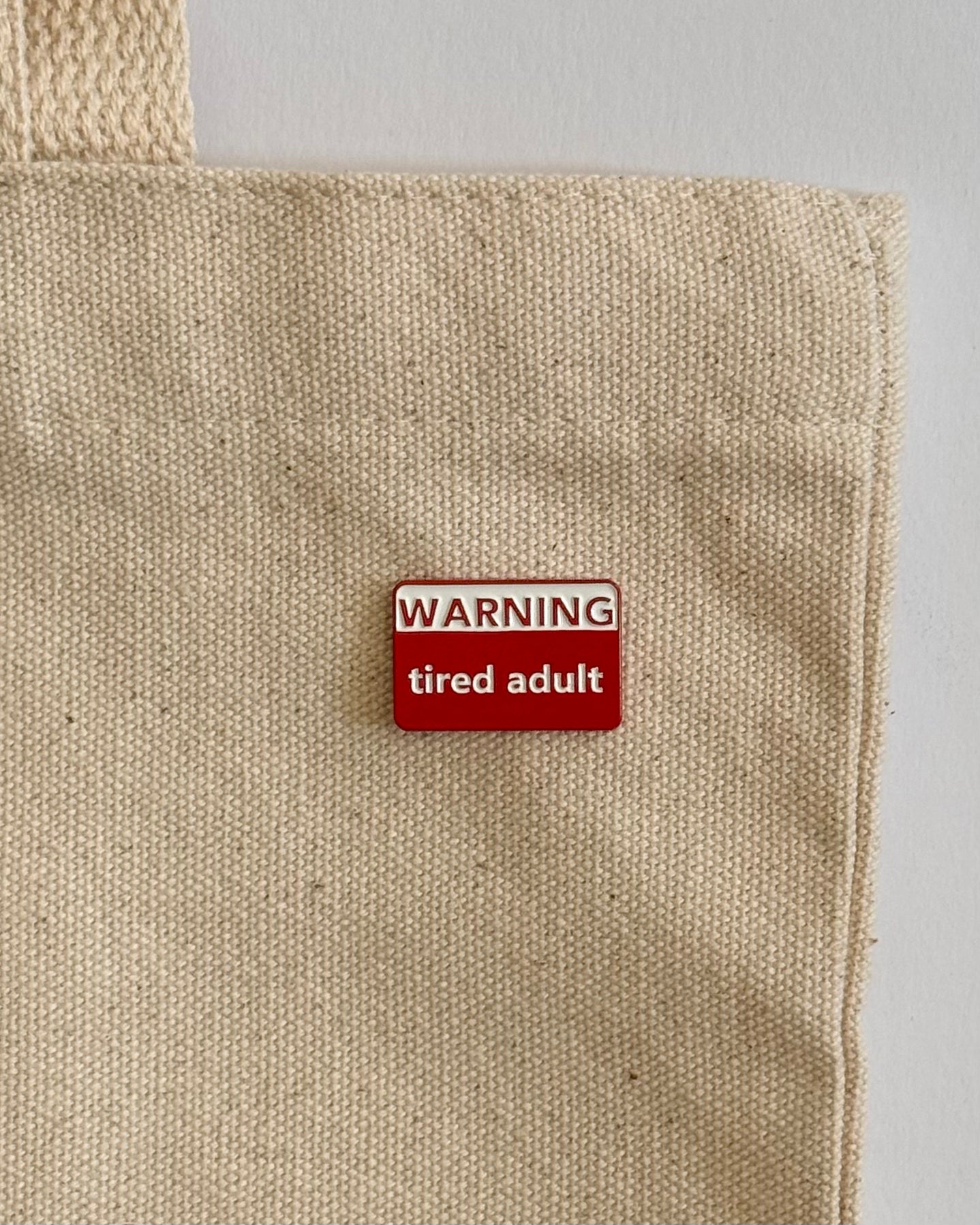 tired adult pin