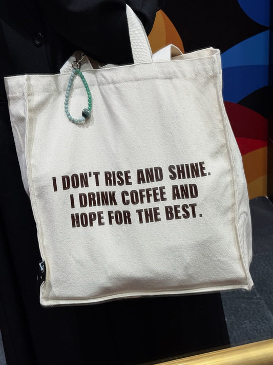 I don’t rise and shine, i drink coffee and hope for the best large tote